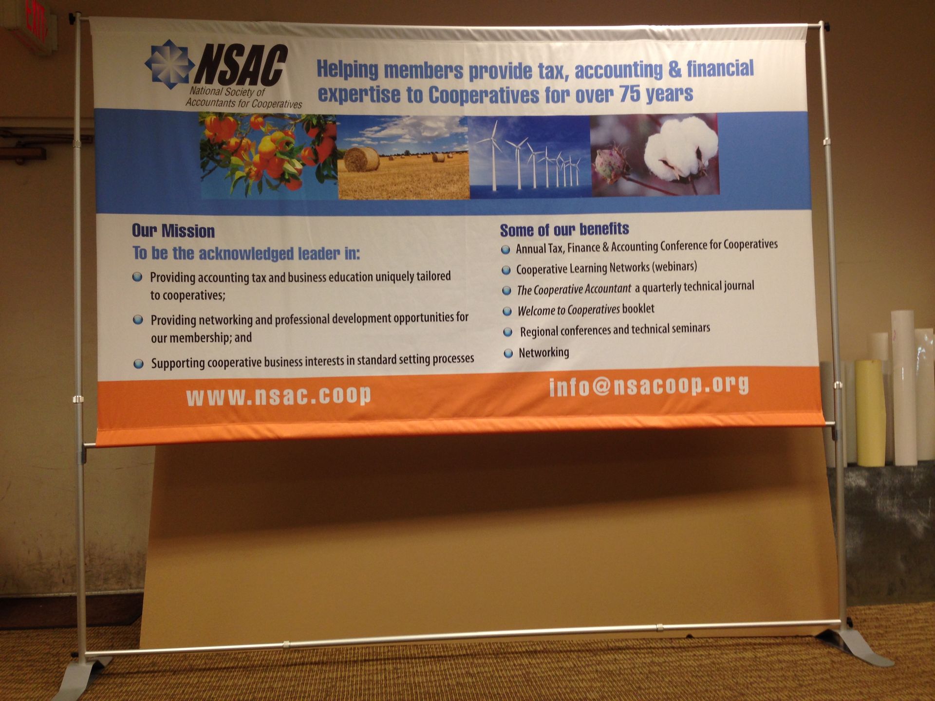 Banner stand for NSAC with their logo, vision, and core ideals displayed.