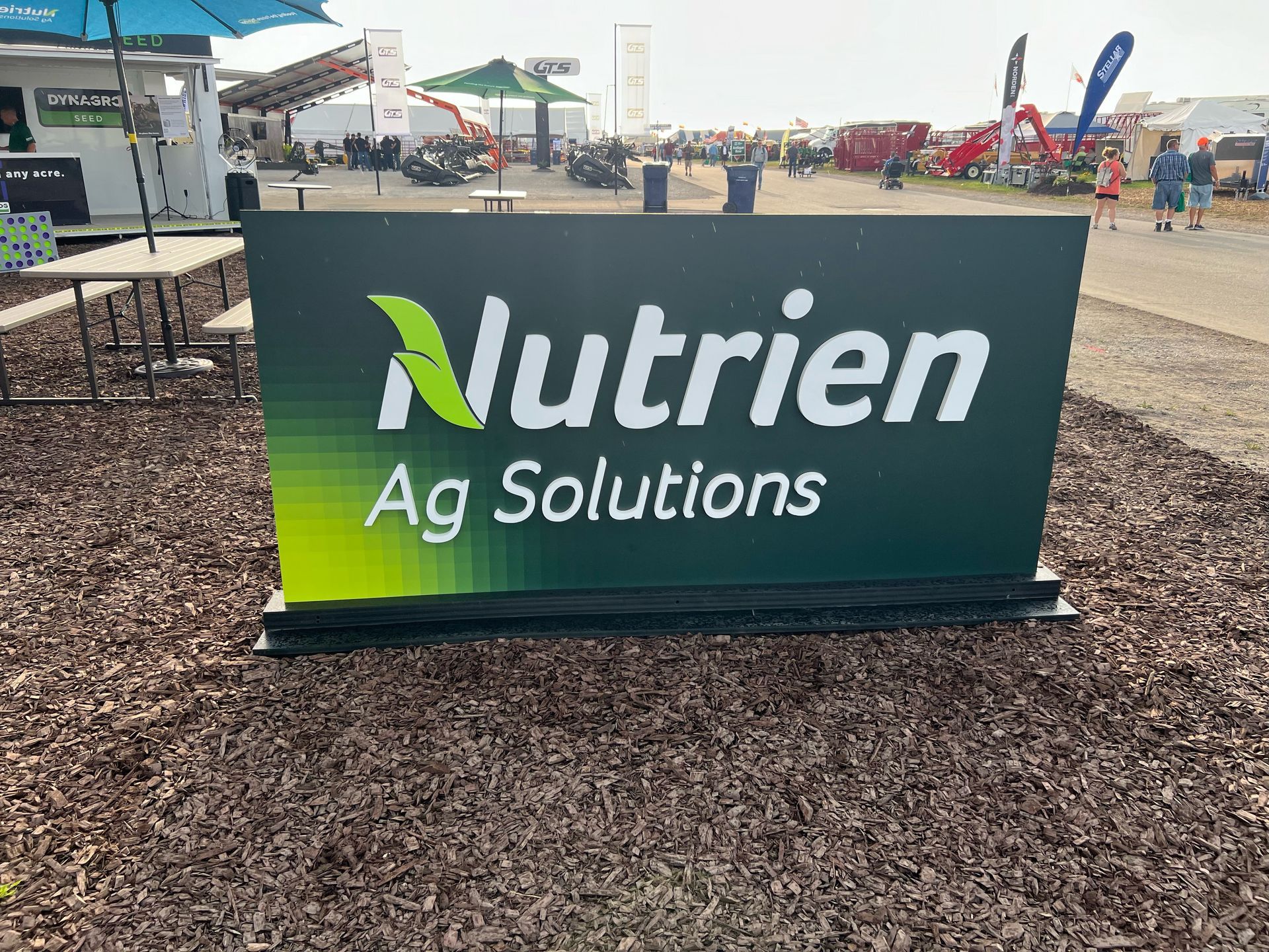 Sign for Nutrien Ag Solutions with a green gradient background.