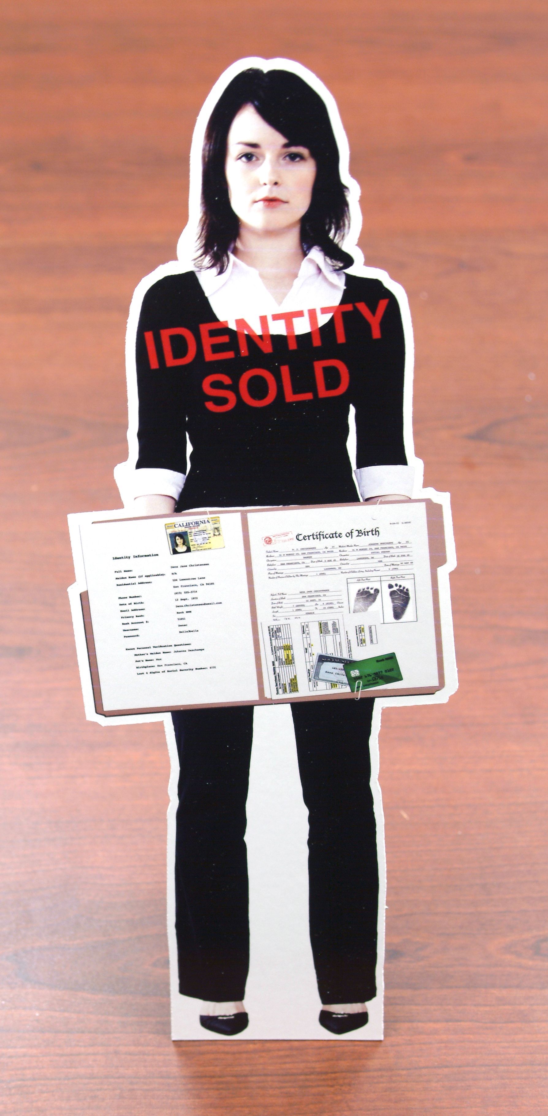 Cardboard cutout of a woman holding a document with 