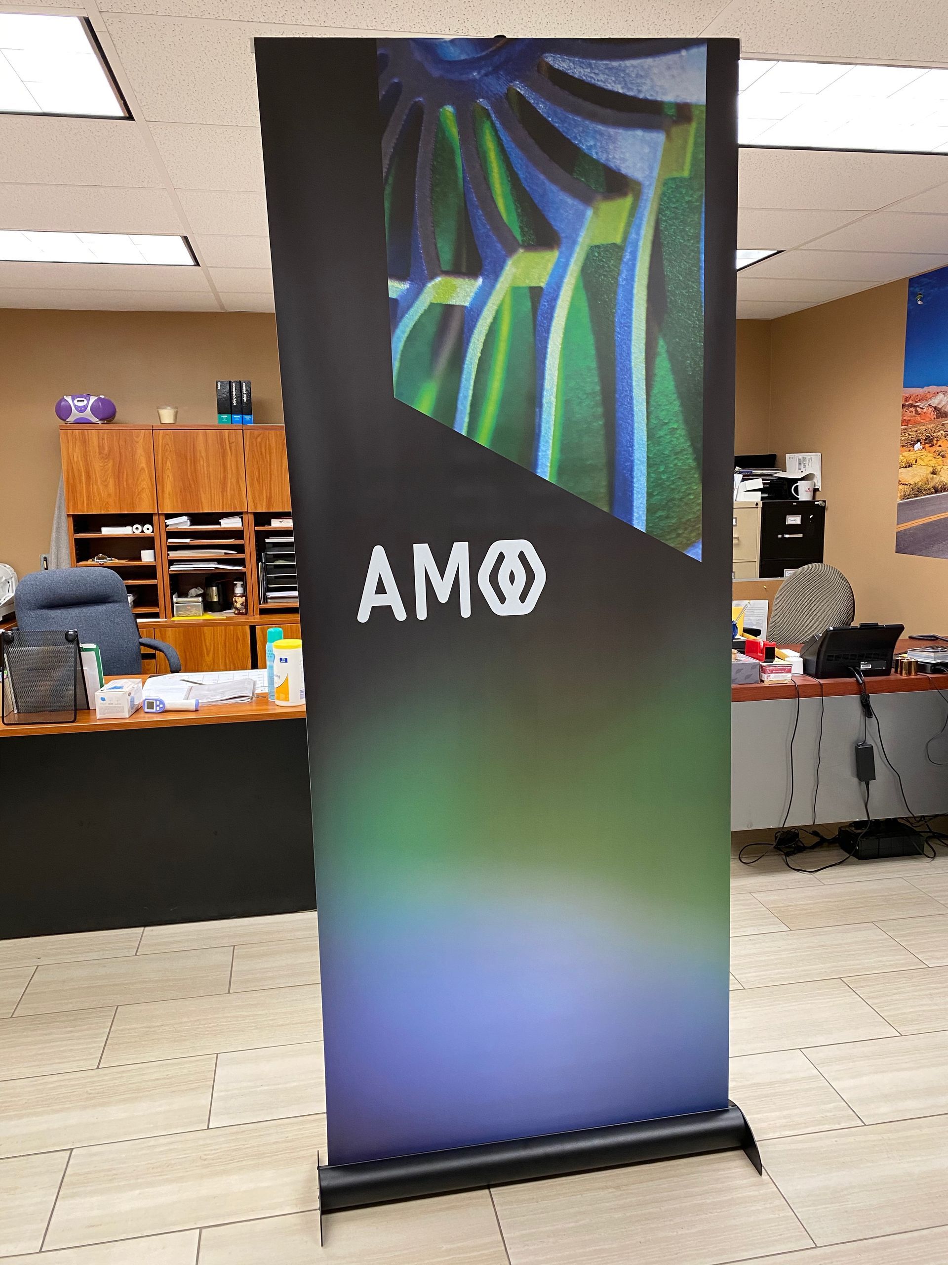 A roll-up banner with the logo