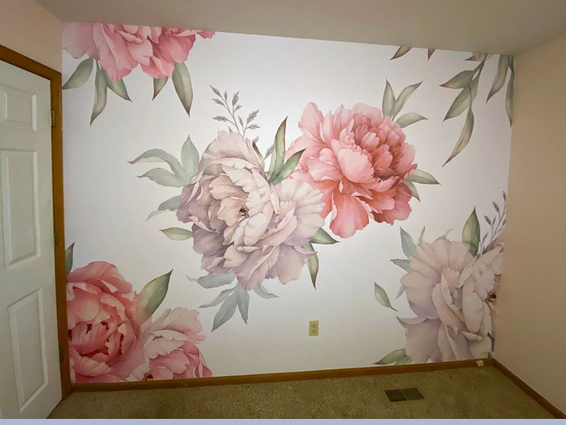 Floral peony wall mural in soft pink and muted green.