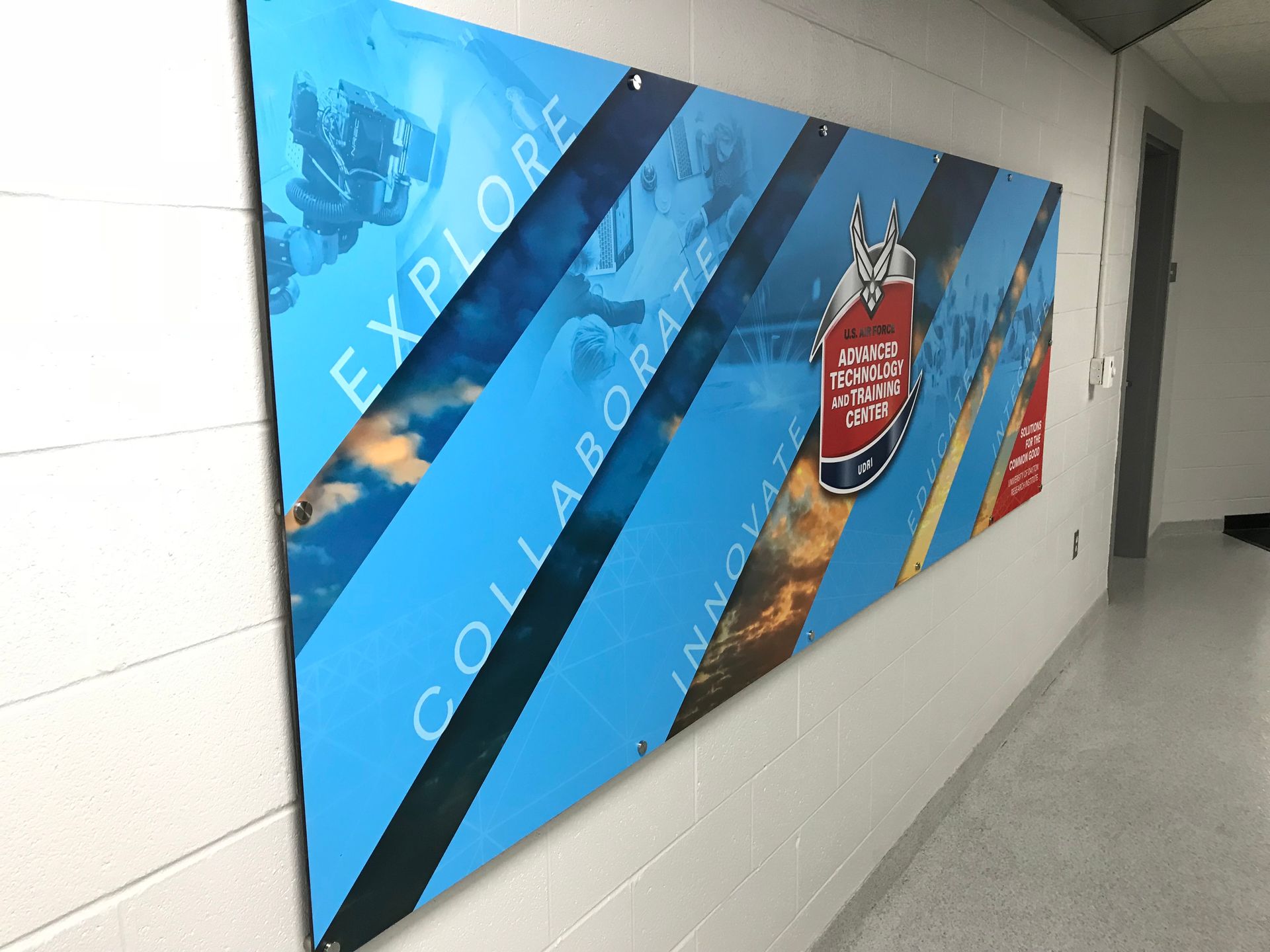 Blue banner on a white wall. It says 