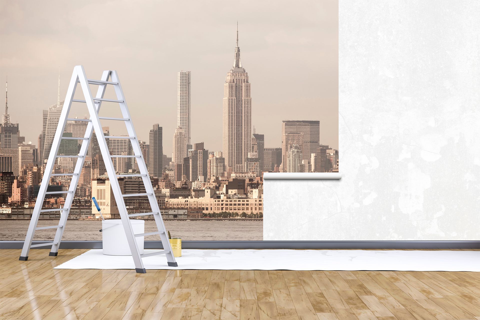 Ladder and paint supplies beside blank wall in a room; skyline view of New York City.