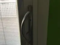 Window handle on a sliding glass door.