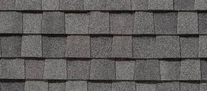 Close-up of gray asphalt roof shingles.