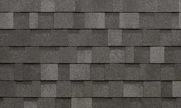 Gray asphalt roof shingles in a staggered pattern.