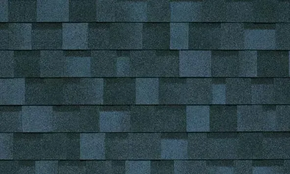 Dark blue asphalt roof shingles.