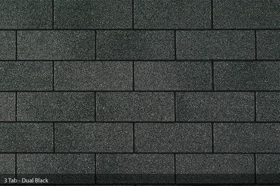 Dark gray asphalt roof shingles in a brickwork pattern.