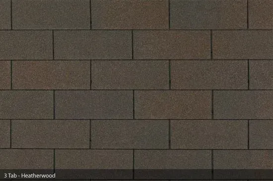 Close-up of brown 3-tab asphalt roof shingles in a brick-like pattern.