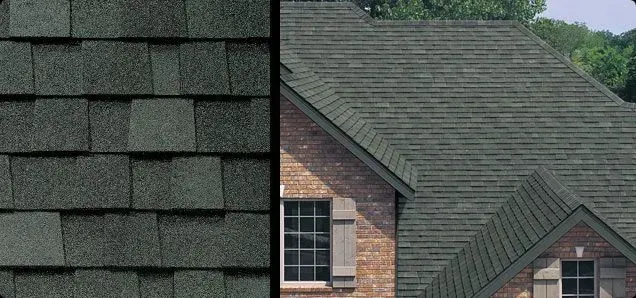Green asphalt shingle roof on a brick house.