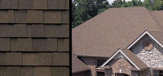 Close-up of brown roof shingles next to a house with a matching roof.