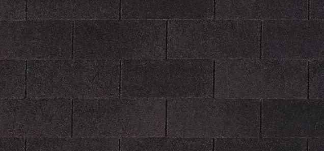 Dark gray brick wall.