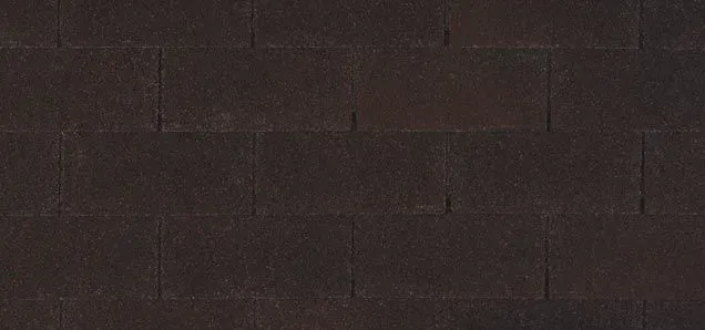 Close-up of a dark brown brick wall, rectangular bricks arranged in an offset pattern.