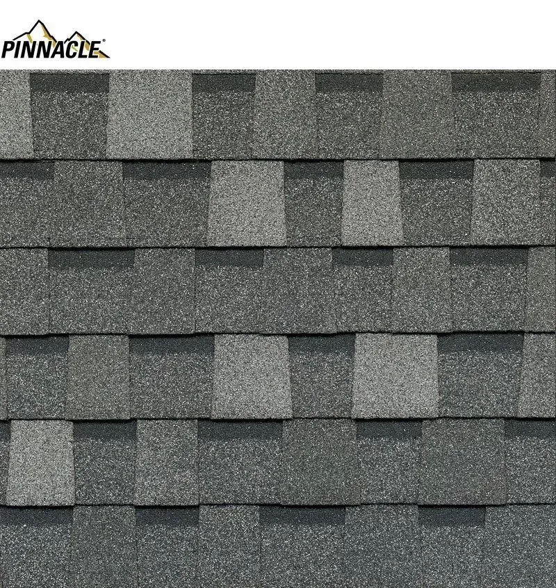 Gray asphalt roofing shingles with varied shades and texture.