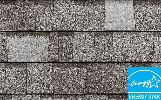 Gray and light gray asphalt roof shingles with an Energy Star logo.