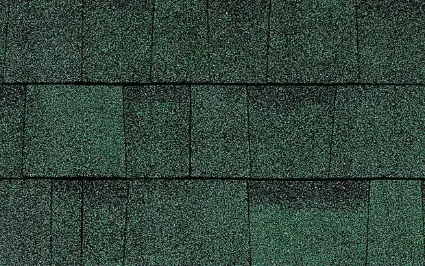 Green asphalt roof shingles.