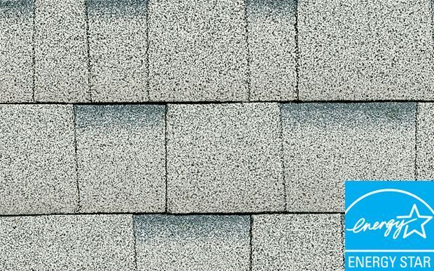 Close-up of light gray asphalt shingles, with Energy Star logo in the bottom right corner.