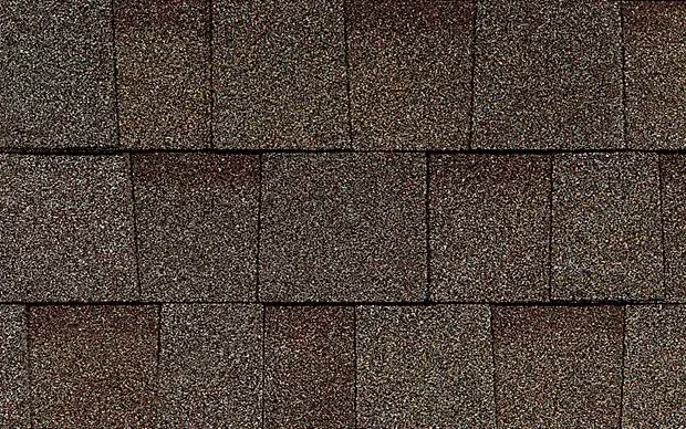 Brown asphalt shingles on a roof.
