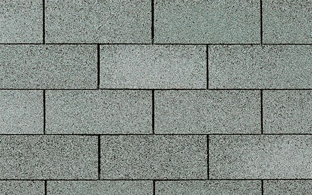 Gray rectangular bricks arranged in a running bond pattern.