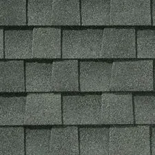 Close-up of overlapping gray asphalt roof shingles.