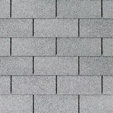 Gray asphalt shingle roof. Rectangular tiles arranged in an overlapping pattern.