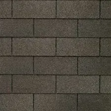 Dark brown asphalt shingles arranged in a brick pattern.