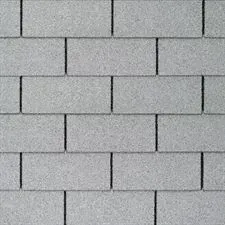 Grey asphalt roof shingles, textured, overlapping pattern.