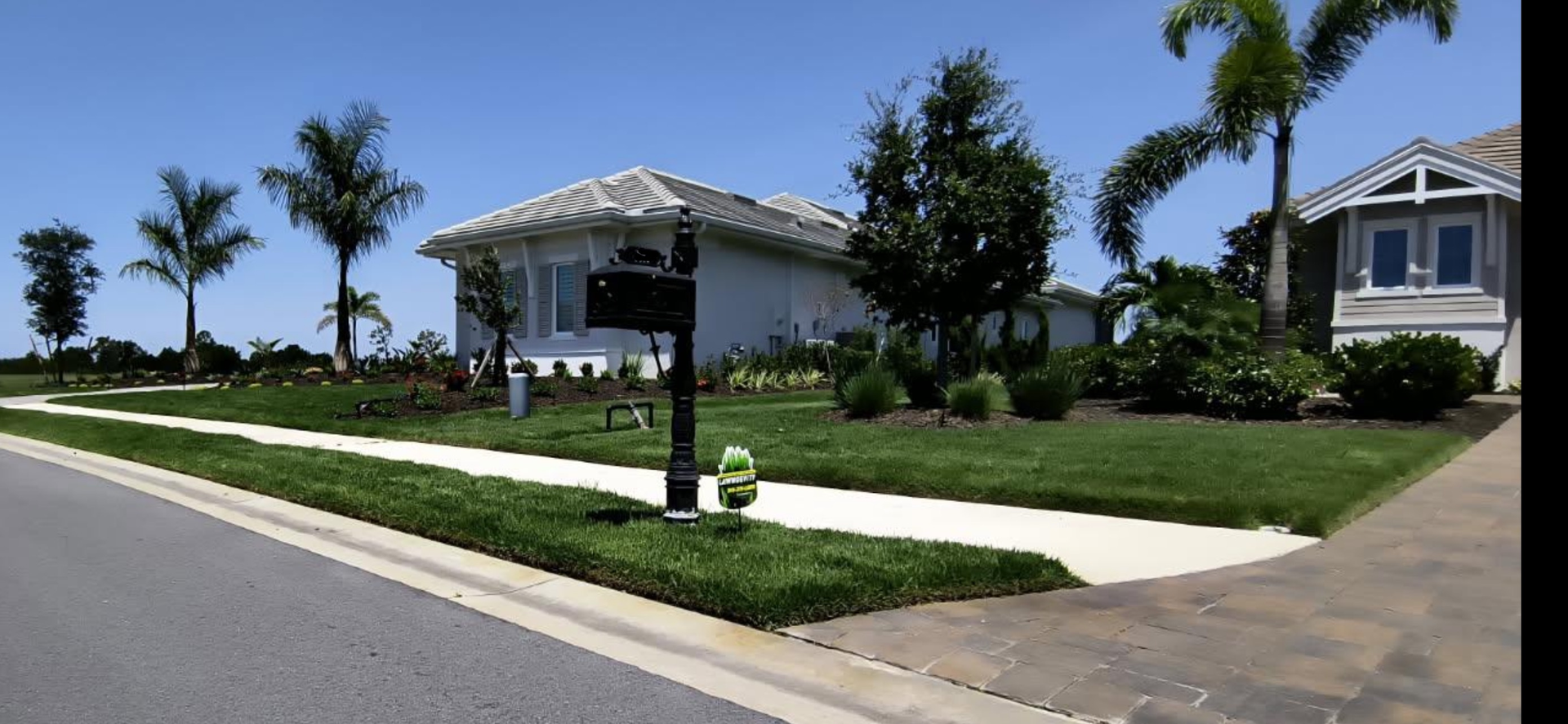 A white house with a mailbox in front of it