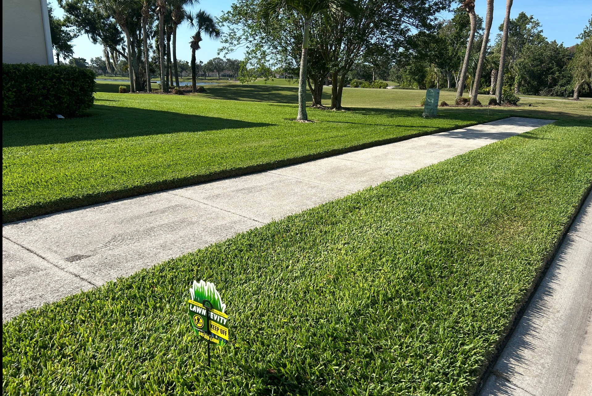 A lawn with a sign that says' lawn care' on it