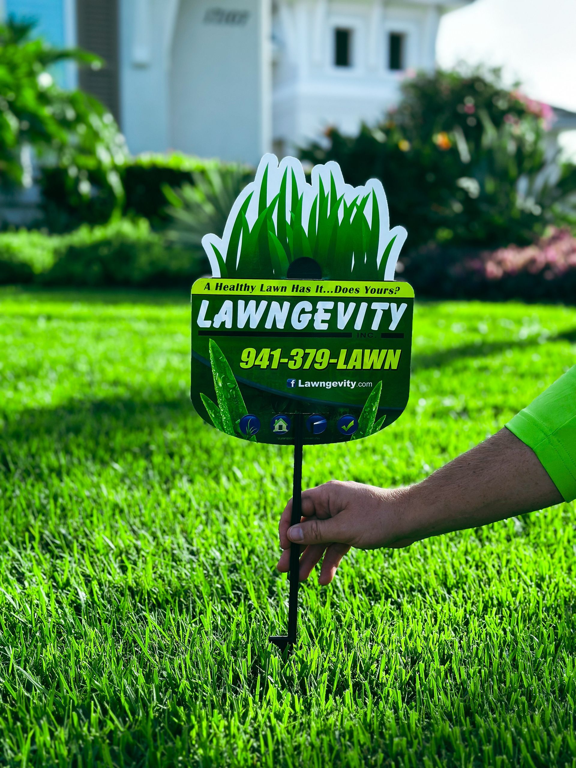 Longevity sign placed in a lush green lawn.