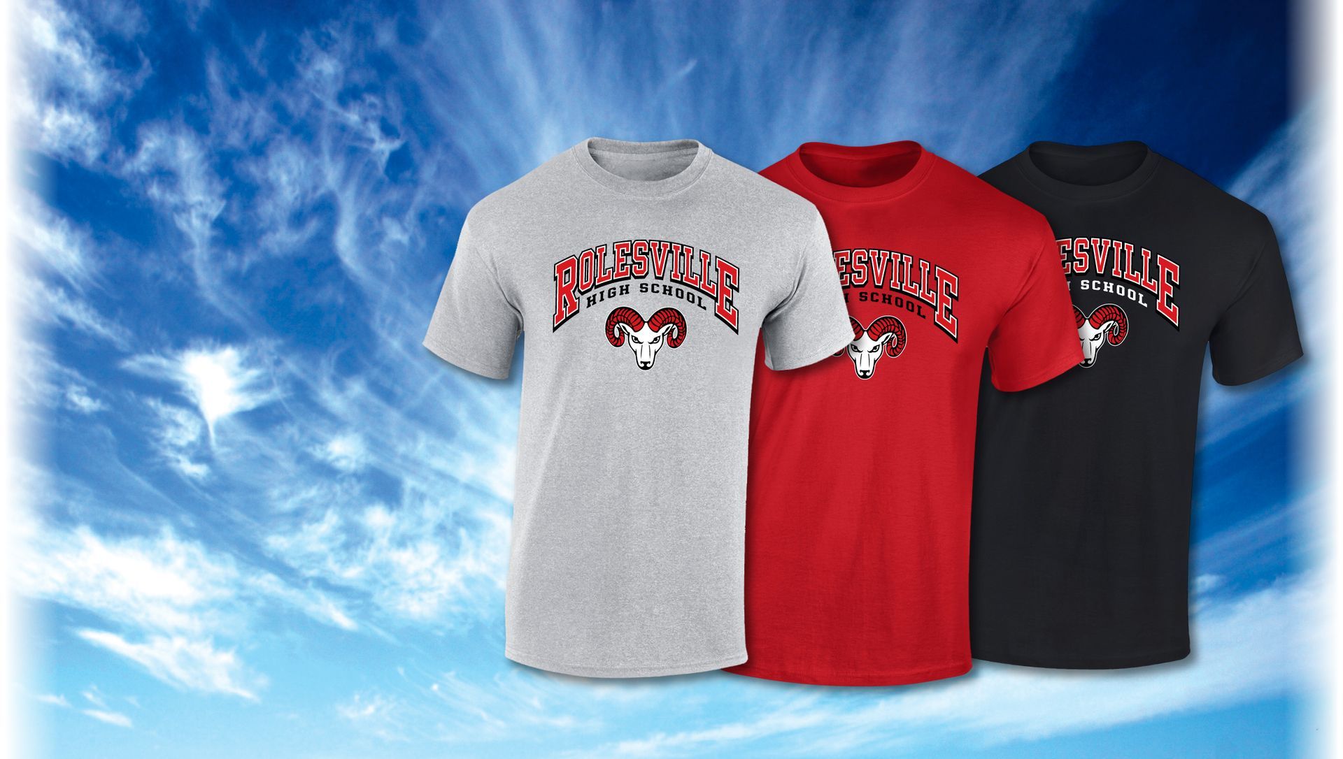 Three t-shirts in gray, red, and black, each featuring a ram logo and text, displayed against a bright blue sky.