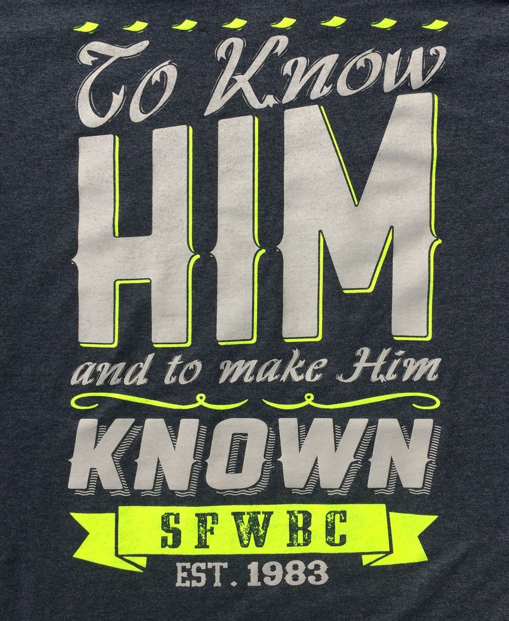 Dark gray shirt with lime green text reading: 