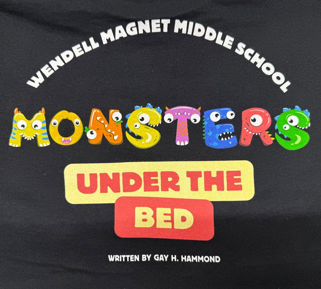 Text on a black shirt reads 