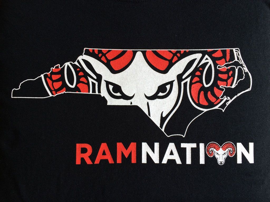 The outline of North Carolina containing a red-and-white ram logo, with 