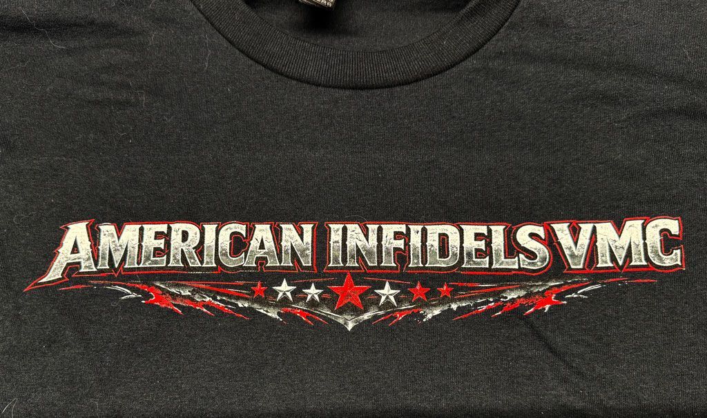 Text on a black shirt reads 