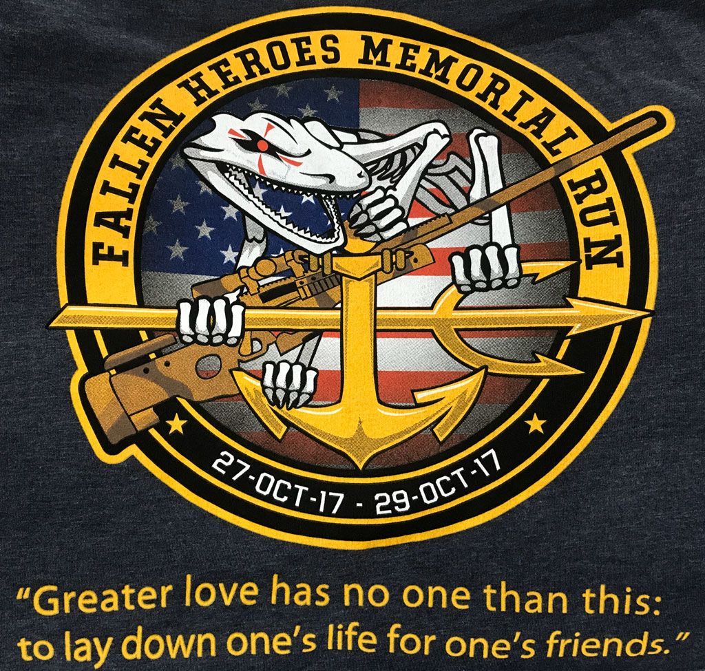 A logo for the Fallen Heroes Memorial Run featuring a skeletal figure holding a rifle and trident over a U.S. flag.