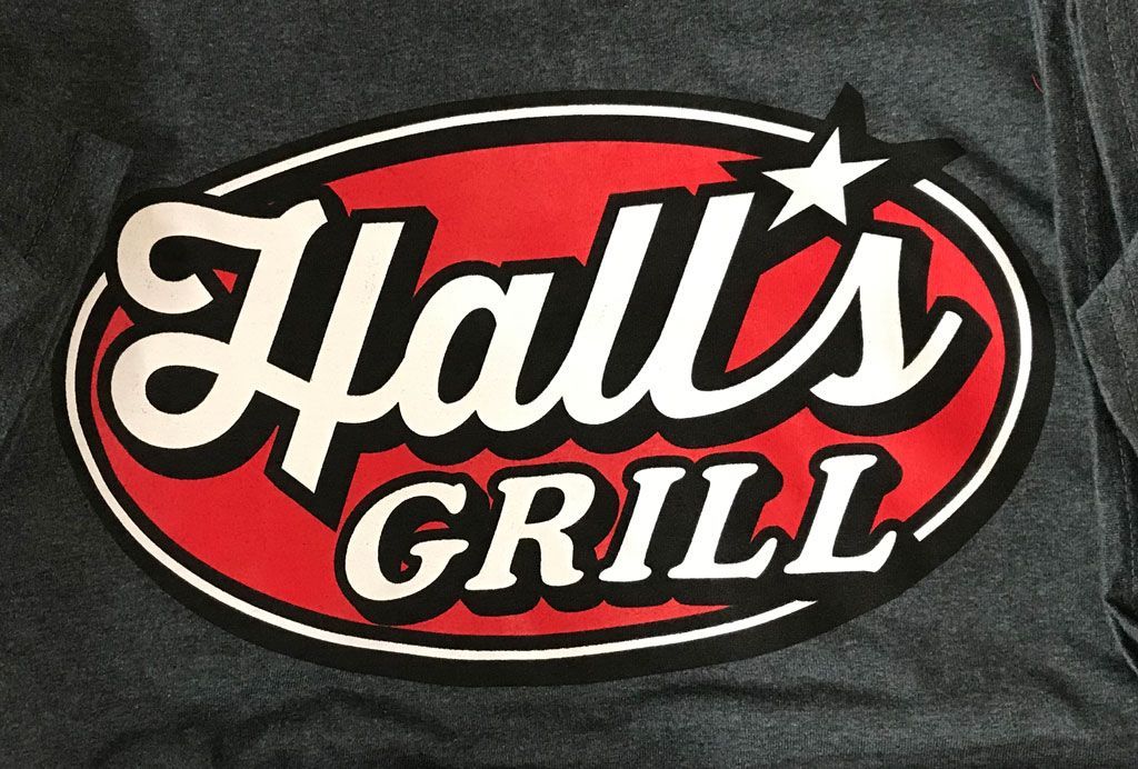 A red, oval-shaped logo with the words 