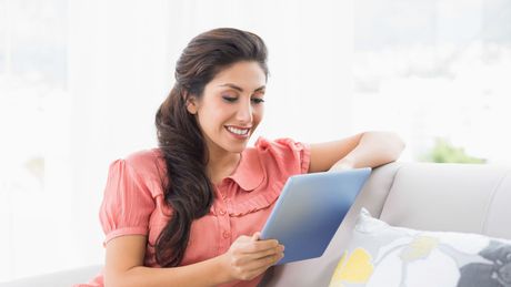 Woman reading a tablet device