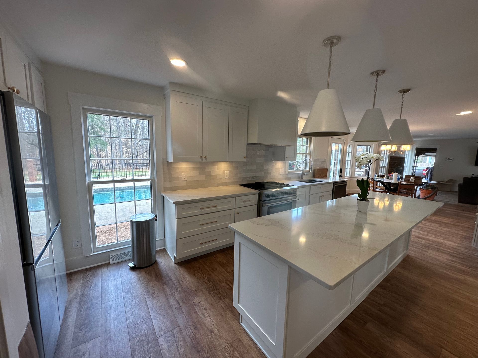 There is a large island in the middle of the kitchen.