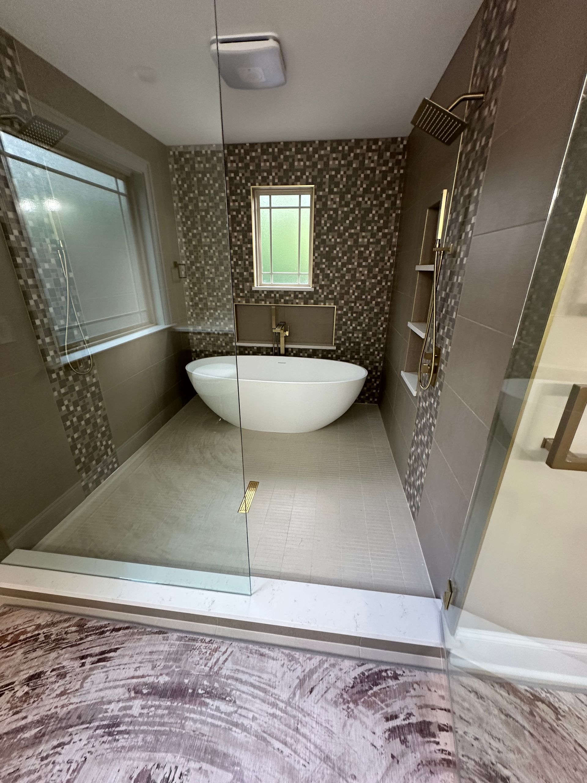 There is a bathtub in the middle of the bathroom.