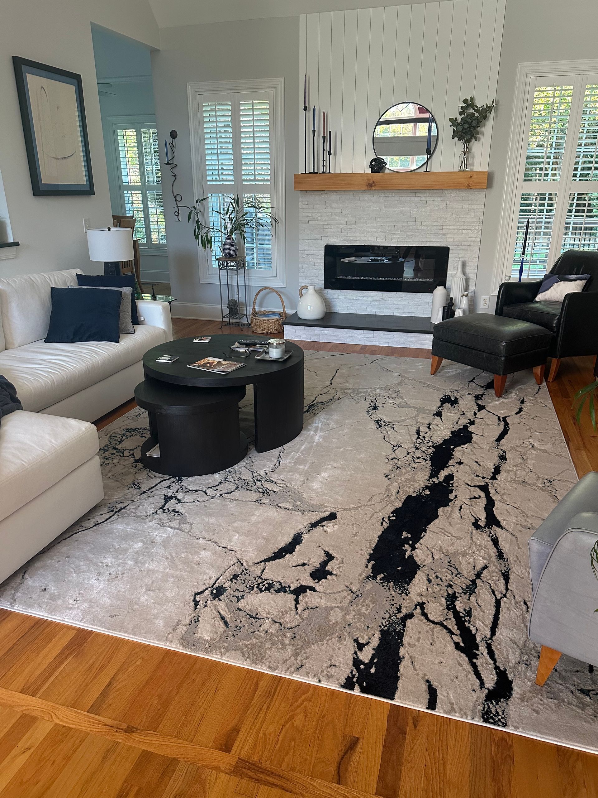 A living room filled with furniture and a fireplace.