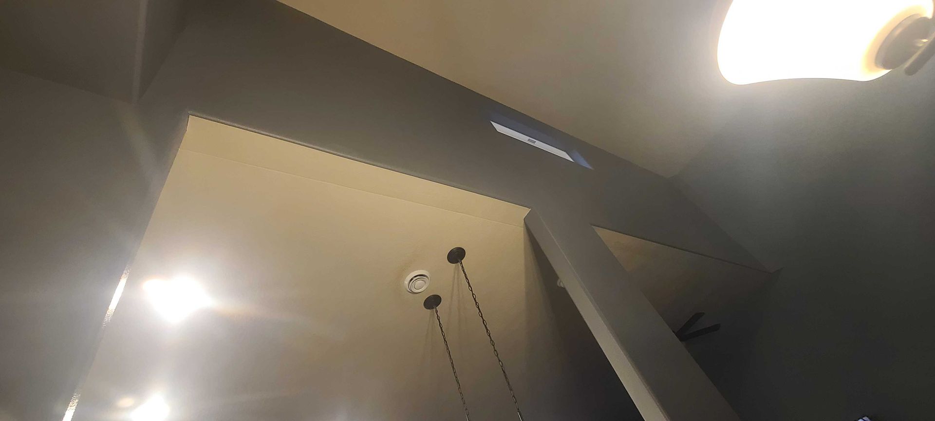 A ceiling with a lot of lights hanging from it.