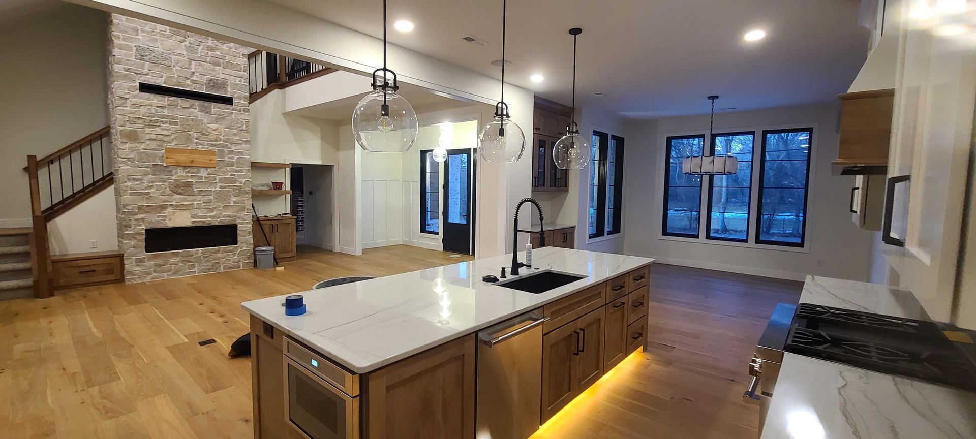 A kitchen with a large island in the middle of the room.