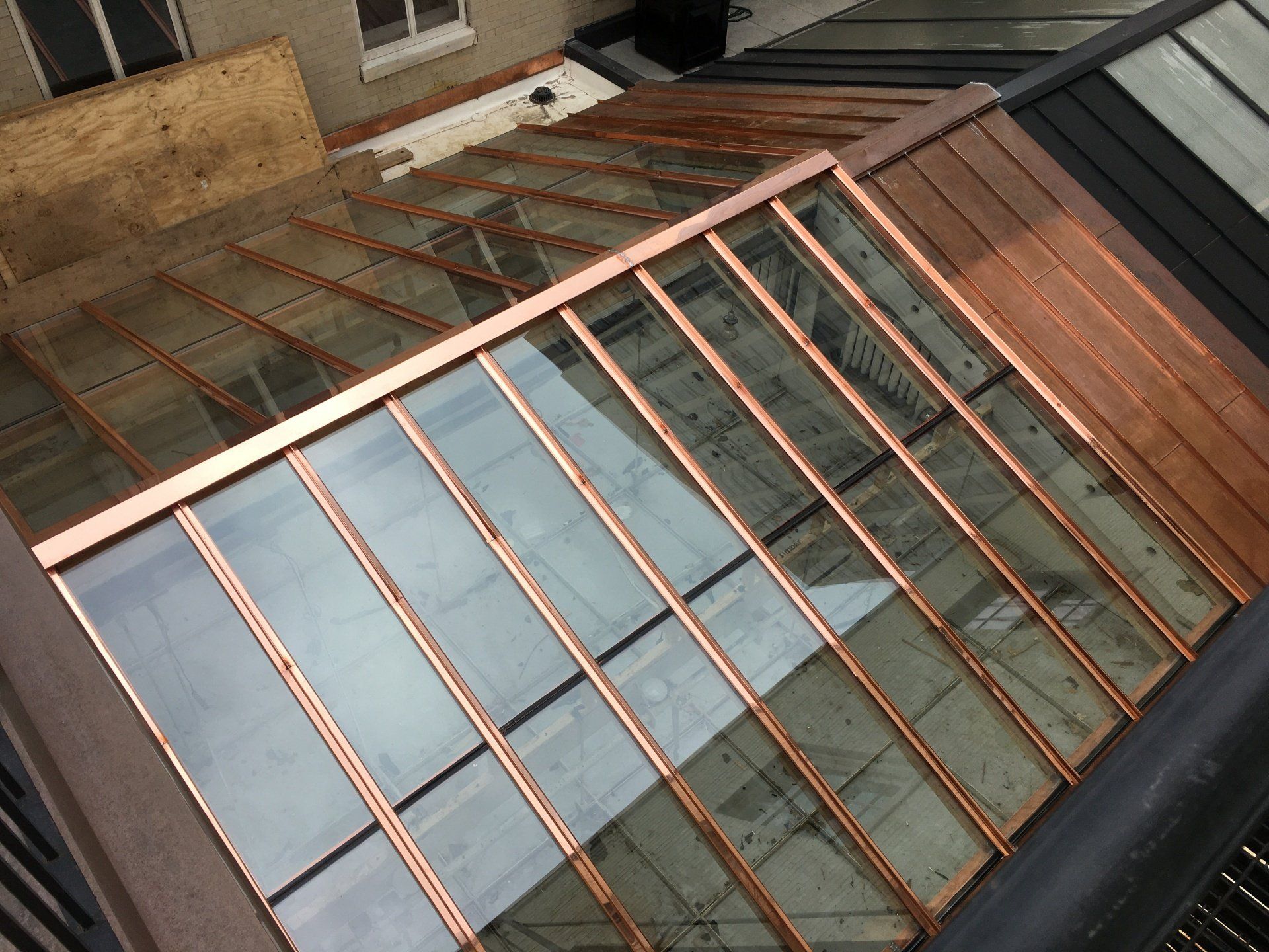 A building with a copper roof and a glass roof