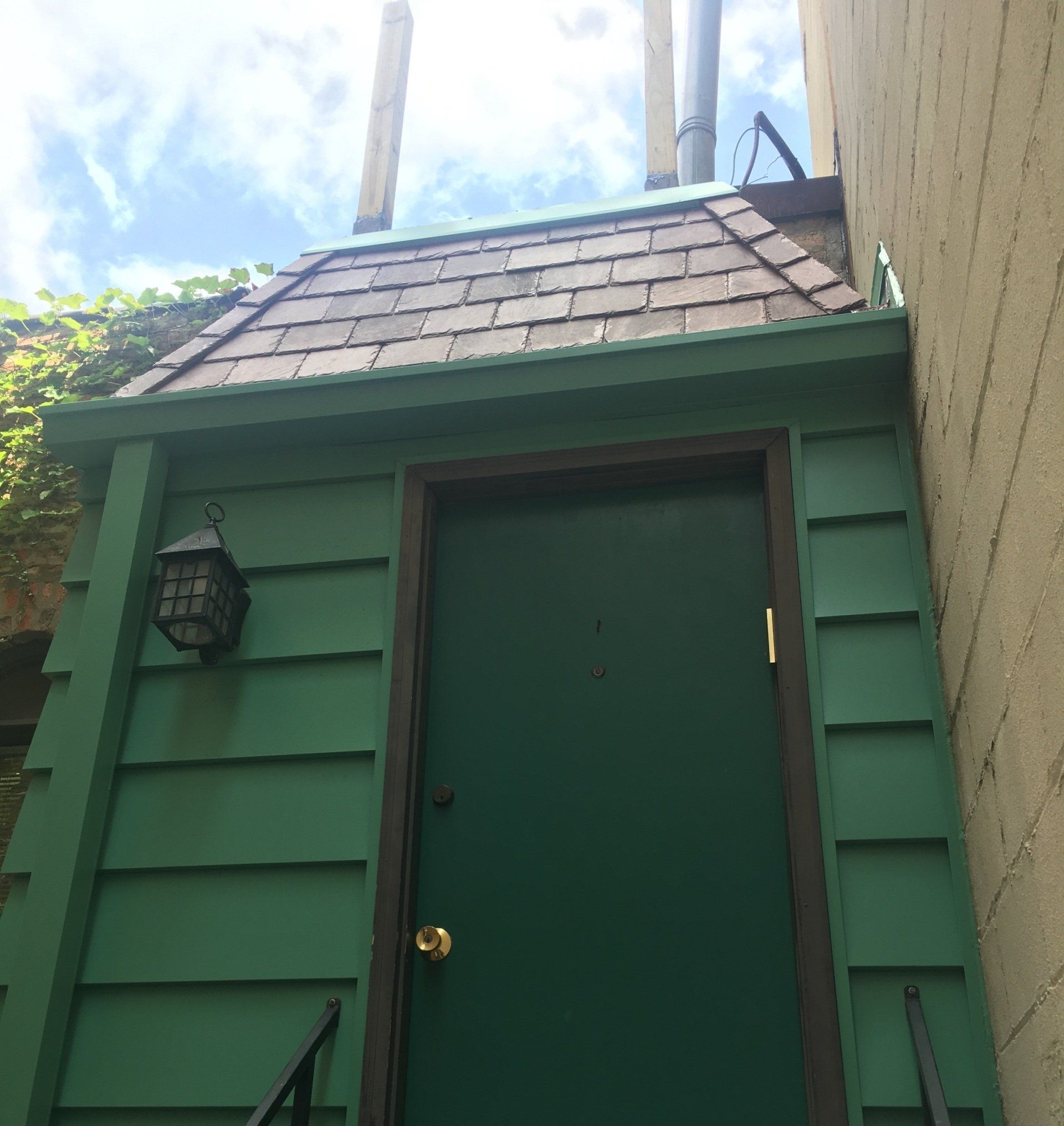 New slate roof, metal siding, and gutters