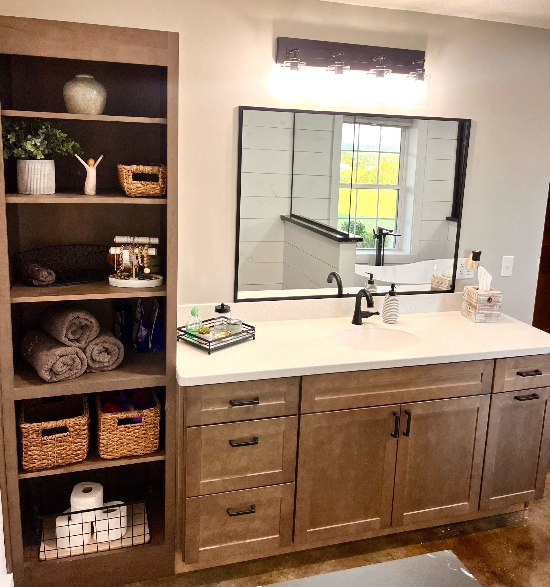 A bathroom with two sinks and a large mirror