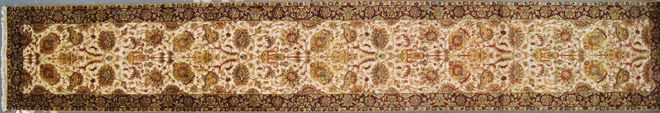 Beige and brown decorative floral rug with an ornate repeating pattern