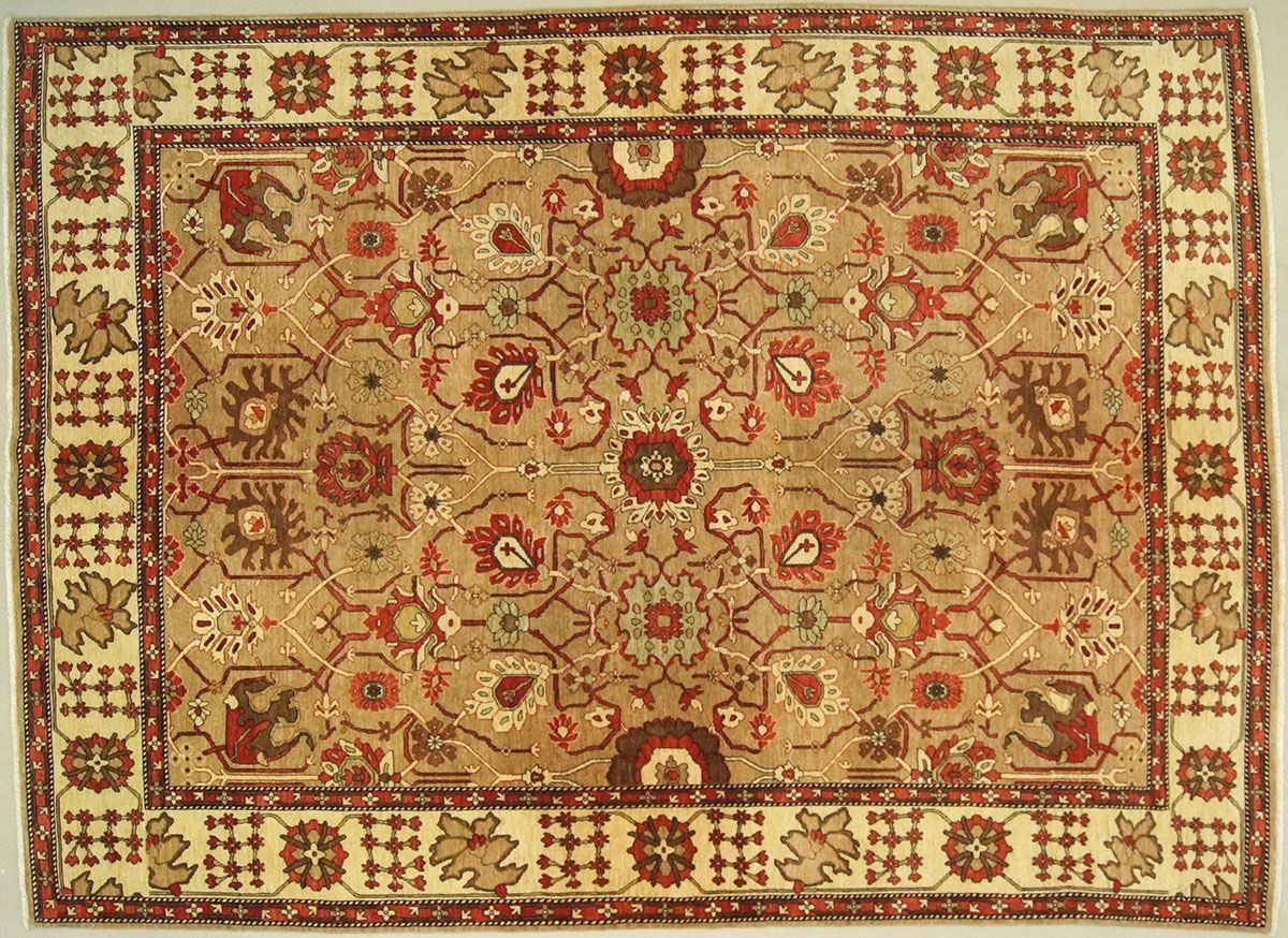 Beige and red patterned rug with floral and geometric designs.