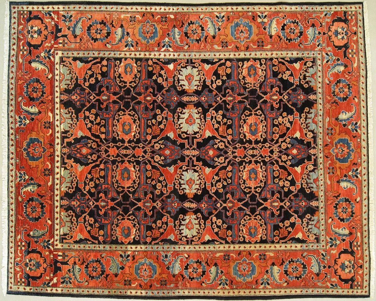 Oriental rug with ornate floral and geometric patterns in shades of red, orange, and black.