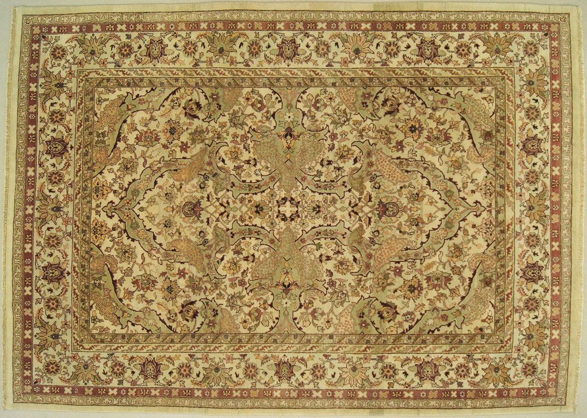 Beige and brown patterned rectangular rug.